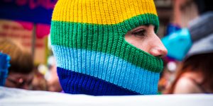 Picture of a woman covered in rainbow hood